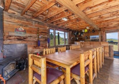 Grizzly Cabins0A dining table and fireplace